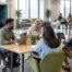 Colleagues work together in an office with quiet spaces and accessible pathways